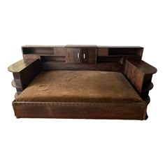 a wooden bench with brown leather cushion on it's back and two drawers at the top