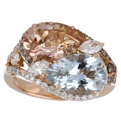 Elegant and exquisitely detailed Cocktail 18K Ring, centre set with 2.36 Cts. Pear Morganite and 2.47 Cts Pear Aquamarine. Surrounded and enhance on shank with white and chocolate colour Diamonds, weighing approx. 0.87 ct. Beautifully Hand crafted in 18 Karat Rose Gold. Stone Size: Morganite: 12 x 8 mm Aquamarine: 12 x 8 mm Gemstone Carat Weight: Morganite: 2.36 Cts. Aquamarine: 2.47 Cts Diamonds: GH-SI (white) Approx. Wt.: 0.87 Cts. (Total) Ring Size: US 7 *Ring size can be adjusted for free up Luxury Octagon Diamond Ring With Gemstone, Luxury Multi-stone Morganite Jewelry, Luxury Marquise Multi-stone Diamond Ring, Luxury Oval Multi-stone Diamond Ring, Luxury Gemstones With Diamond Accents, Luxury Morganite Diamond Ring For Anniversary, Luxury Pear-shaped Diamond Ring With 17 Jewels, Luxury Round Cut Gemstones With Diamond Accents, Luxury Multi-stone Rose Gold Ring