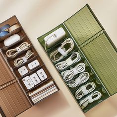 an open box with several different types of cords and plugs in it, sitting next to each other