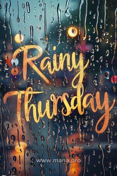 rain is pouring down on the window and it says rainy thursday in gold lettering