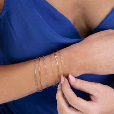 The Element Short Link Bracelet is a sleek and stylish accessory that adds a touch of sophistication to any outfit. With its elongated links and secure lobster clasp, this bracelet is perfect for layering or wearing on its own. Whether you're dressing up for a night out or keeping it casual, this versatile piece will be your go-to for a touch of elegance. The Element Short Link Bracelet is a 1.95 mm 14k solid gold elongated link chain with a lobster clasp closure. Wear it alone, or mix and match Modern Rose Gold Chain Bracelet With Rectangular Links, Modern Rose Gold Oval Link Chain Bracelet, Modern Delicate Chain Rose Gold Bracelets, Modern Oval Link Bracelet With Extender, Modern Gold Link Bracelet With Delicate Chain, Modern Oval Link Delicate Chain Bracelet, Modern Delicate Chain Bracelet With Oval Links, Modern Delicate Chain Oval Link Bracelet, Modern Link Paperclip Bracelet With Extender