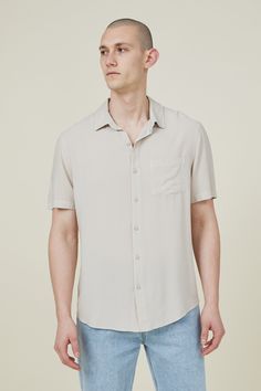 The cuban short sleeve shirt is a staple for your shirts collection. Features a loose fit, button front, chest pocket and short sleeves.

Features:  
- front chest pocket - loose Fit - Classic button up shirt style - Short sleeves - collar Short Sleeve Button-up Shirt With Pockets For Summer, Summer Short Sleeve Button-up Shirt With Pockets, Summer Button-up Short Sleeve Shirt With Pockets, Everyday Collared Camp Shirt With Button Closure, Casual Shirt With Buttoned Pockets And Camp Collar, Solid Color Johnny Collar Shirt For Summer, Solid Color Johnny Collar Summer Shirt, Solid Johnny Collar Shirt For Summer, Solid Johnny Collar Summer Shirt