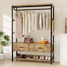 a clothes rack with shoes and handbags on it next to a dresser in a white room