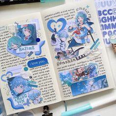 an open book with some stickers on the pages and various items around it,