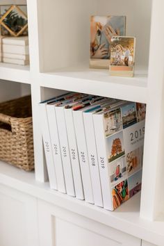 a white book shelf filled with lots of books