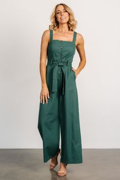 Baltic Born exclusive style Adorable jumpsuit for a day out on the town Deep Kelly green color Linen blend material has no stretch Straight neckline Functional buttons down bodice Tank sleeves Hidden pockets on both sides Removable self-tie belt at waist Wide-leg pant style Unlined Trina is 5'6, cup size 32D, size 2 and is wearing size S Green Overall Jumpsuit For Day Out, Fitted Green Overalls For Spring, Casual Green Jumpsuits And Rompers For Work, Fitted Green Overalls For Workwear, Casual Green Jumpsuits For Workwear, Cotton Jumpsuits And Rompers With Buttons For Day Out, Fitted Green Jumpsuits And Rompers For Day Out, Fitted Green Jumpsuits For Day Out, Green Buttoned Jumpsuits And Rompers