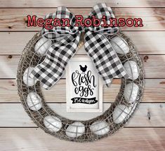 a black and white wreath with the words fresh eggs on it