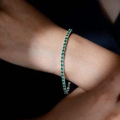 Product Details Elevate your gifting game with this stunning and beautiful Created Emerald Tennis Bracelet, adorned with Round Shape Lab Created Emerald gemstones elegantly set in a secure Prong Setting. This bracelet is not just a gift; its a unique and timeless expression of your appreciation. Shell proudly wear it on any occasion, cherishing both the bracelet and the sentiment behind it. Product Information SKU SHP-BRACELET072017906 Length 178 mm Width 3 mm Weight 8.45 gm (Approximate) LAB CR Emerald Tennis Bracelet, Lab Created Emerald, Yellow Gold Bracelet, Emerald Gemstone, Tennis Bracelet, Arm Band, Prong Setting, Round Shape, Lab Grown