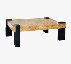 a wooden table with black metal legs on a white background