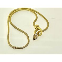 This is part of Chairish’s Fine Jewelry assortment.  This piece is from the early 1900's and is very special as it is longer than most snake necklaces. Women were much smaller then, so most are 13" to 15" necklaces.  This necklace is 16" plus the drop for the snakes head. Perfect for most women. This snake has a beautiful carved and detailed face with a 0.20 point Diamond on his head. This is marked 750 and weighs in at 24.62 grams of gold.  I just love snake jewelry as many of you now but seldom do I purchase these snake necklaces because they are too small for most.  Unless they are 16" or better I let them go.  This one fits the bill as it is 16" plus the drop for the snakes head. Elegant Snake-shaped Jewelry For Formal Occasions, Elegant Formal Herringbone Chain Necklace, Elegant Formal Herringbone Necklace, Vintage Snake-shape Jewelry For Formal Occasions, Formal Snake Chain Necklace In Fine Jewelry Style, Formal Fine Jewelry Snake Chain Necklace, Vintage Gold Diamond Necklace For Formal Occasions, Victorian Gold Necklace For Evening, Gold Victorian Necklace For Evening