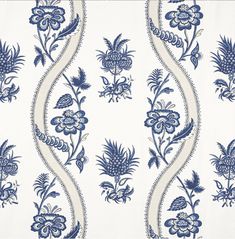 a blue and white wallpaper with flowers on it