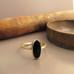 The Ring Made From 14 Karats Solid Yellow Gold. Ring Width 0.06inch/ 1.5mm. 1 Natural Black Onyx 0.23x0.47inch/ 6x12mm. Ring For Women. Beautiful Gold Ring Bezel Set With Black Onyx. A Classic Ring For Women. Available In All Sizes, Color, Gold, And Karat And Matte Or Shining Finish. If You Want To Change Something, Stone, Width, Personal Engraving, Or Anything Else. Please Contact Me, And I Will Build The Dream Ring You Want. If You Want A Custom Ring Please Contact Me Before Purchase. Fine Jewelry Black Stackable Rings, Yellow Gold Onyx Jewelry, Black Stackable Rings Fine Jewelry, Minimalist Onyx Yellow Gold Jewelry, Black Stackable Fine Jewelry Rings, Minimalist Oval Onyx Jewelry, Minimalist Yellow Gold Onyx Jewelry, Minimalist Gold Onyx Ring, Black Oval 14k Gold Rings