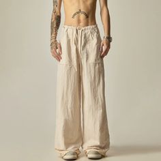 These Wide-Leg Linen Drawstring Lounge Pants offer a relaxed and comfortable fit, perfect for lounging or casual wear. With their airy and lightweight fabric, they provide breathability and ease of movement. Stay stylish and comfortable in these versatile pants. model: 174cm 61kg L material: nylon 100% Wide Leg Summer Cargo Pants For Loungewear, Summer Wide Leg Cargo Pants For Loungewear, Beige Relaxed Fit Pants With Drawstring, Beige Wide Leg Sweatpants With Drawstring, Wide Leg Linen Cargo Pants For Loungewear, Casual Cotton Parachute Pants For Vacation, Baggy Wide Leg Pants With Drawstring For Summer, Baggy Drawstring Wide Leg Pants For Summer, Baggy Summer Wide Leg Pants With Drawstring