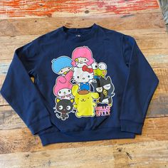 New! Navy Blue. Size Medium Blue Casual Sweatshirt With Cartoon Print, Trendy Blue Sweatshirt With Cartoon Print, Hello Kitty Print Crew Neck Cotton Sweatshirt, Blue Cartoon Print Sweatshirt For Streetwear, Casual Long Sleeve Hello Kitty T-shirt, Cotton Crew Neck Sweatshirt With Hello Kitty Print, Casual Long Sleeve T-shirt With Hello Kitty Print, Blue Cotton Sweatshirt With Character Print, Blue Casual Top With Cat Print