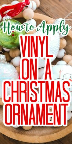 a bowl full of christmas ornaments with the words how to apply vinyl on a christmas ornament