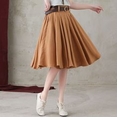 "★★ FEATURES * pure linen skirt * No liner * Two side seam pockets * Right hidden zipper closure * with belt loop * Pleated skirt * A Line Skirt * Perfect for Spring, Summer, Autumn * Wash by hand or machine with cold water ★★ The model is 165 cm (5′ 5″) tall with a 80 cm (31.5\") bust, 66 cm (26\") waist. She is wearing the brown linen skirt in size XS. ★★ Bespoke Order Service If you Request other color Request the length Your height is not between 155 cm- 172 cm Your weight is over 75 kg I ca Non-stretch Long Brown Skirt, Non-stretch Brown Long Skirt, Non-stretch Pleated Knee-length Skirt, Non-stretch Cotton Pleated Skirt, Cotton Non-stretch Pleated Skirt, Non-stretch Brown Cotton Skirt, Brown Cotton Flared Skirt, Casual Brown Pleated Midi Skirt, Brown Cotton Knee-length Skirt