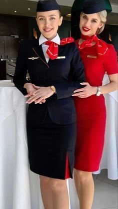 two air hostess standing next to each other