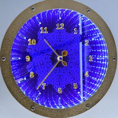 a blue clock with numbers on the face