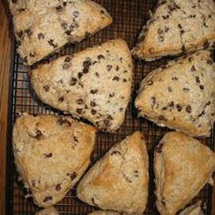 several scones on a cooling rack with chocolate chips