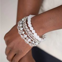 Infused With Silver Accents, A Glassy Collection Of White And Metallic Crystal-Like Beads Are Threaded Along Stretchy Bands Around The Wrist For A Whimsically Layered Look. Sold As One Set Of Six Bracelets. Bag 2 Bin B White Round Beads Crystal Bracelet For Party, White Crystal Bracelet With Round Beads For Party, White Beaded Crystal Bracelet For Party, White Crystal Bracelet For Party, White Crystal Beaded Bracelets For Party, White Crystal Bracelet With Faceted Beads For Party, Bracelets Bag, Silver Beaded Bracelet, Sparkle Bracelet