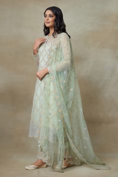 Mint silk organza kurta with resham floral patterns and sequins highlighted in diamond shaped golden artwork. Comes with embroidered hem pant, dupatta and an inner slip. - Aza Fashions Elegant Pista Green Set With Cutdana Detailing, Elegant Pista Green Set With Cutdana, Tissue Silk Churidar For Reception, Silk Sets With Sheer Dupatta For Transitional Season, Elegant Pista Green Cotton Silk Sharara, Fitted Organza Palazzo Set With Cutdana, Elegant Pista Green Cotton Silk Traditional Wear, Elegant Green Palazzo Set With Self Design, Elegant Pista Green Traditional Cotton Silk Wear