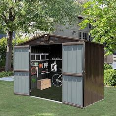 an outdoor storage shed with its doors open and tools in the garage compartment on the side