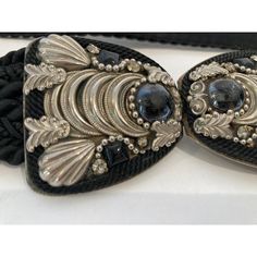 Judith Leiber Black Belt with Silver and Black Stones bubble Buckle. black cotton silk velvet waist belt. Categories : Women Category: Accessories Sub-category: Belts Material: Cotton Color: Black Buckle is 2" H x 4 " wide. Total Length 25 inches. Known for her amazing purses, Judith Leiber’s creativity continued with accessories such as this beautiful estate adjustable belt from the 1980s with semi-precious stone-studded. Hungarian born Judith Leiber (1921-2018) was known as the handbag designe Luxury Black Embroidered Belt, Designer Party Belts, Elegant Black Party Belt, Vintage Black Adjustable Belt, Formal Black Embroidered Belt, Vintage Adjustable Belt For Party, Adjustable Vintage Party Belt, Elegant Black Belt For Evening, Chic Black Belt For Evening