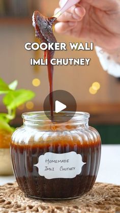 someone is pouring sauce into a jar with food in it and the caption reads cooker walli imli chutney