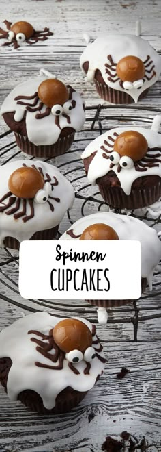 cupcakes with white frosting and chocolate drizzled on top are sitting on a wire rack