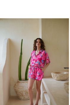 "Get ready to take on your travel vacation and rest days in this cozy and lightweight two-piece set featuring a play, live, shine, bright print button down collar shirt and comfy pull-on design with stretchy elastic waist band short. An essential two-piece set outfit for your summer travel packing or a pajama set. One sizing button down shirt can be easily dress up and down, from beach day cover up to causal night out look. Shorts: Pull-on design with stretchy elastic waist band. Our model is 5' Summer Sets With Elastic Waistband And Shorts, Relaxed Fit Shorts For Summer Pajama Party, Casual Summer Pajama Party Sets, Summer Matching Set Sleepwear For Lounging, Spring Vacation Sets With Elastic Waistband, Spring Vacation Set With Elastic Waistband, Summer Lounging Sets With Short Sleeves, Summer Lounging Short Sleeve Sets, Pink Summer Top For Lounging