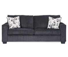 a gray couch with two pillows on it