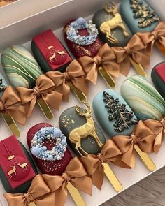 an assortment of decorated chocolates in a box