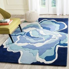 a blue and white rug in a living room