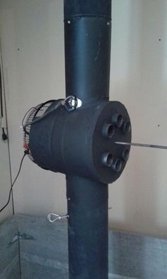 a black pipe with wires attached to it