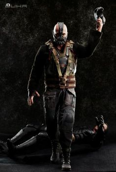 the dark knight rises action figure is shown with his hands in the air and one hand out