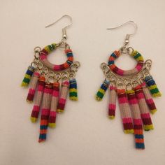 Earrings For Women In A Collected Old Blanket Were Made By Peruvian Artisans From Cusco, Using Old Handmade Blankets With Natural Pigments. Due To The Polychromy Or Variety Of Colors, Coloring Techniques, Weaving And Applications, And With The Fine Fibers Used. These Earrings Are Handmade By Peruvian Artisans From The Andean Community Of Cusco. Adjustable Multicolor Fair Trade Earrings, Adjustable Multicolor Bohemian Hoop Earrings, Multicolor Festive Jewelry With Ear Wire, Festive Multicolor Jewelry With Ear Wire, Multicolor Fair Trade Beaded Earrings, Multicolor Woven Adjustable Beaded Earrings, Adjustable Multicolor Woven Beaded Earrings, Traditional Pink Earrings For Summer, Colorful Traditional Earrings