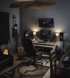 a living room filled with furniture and a guitar on the table in front of it