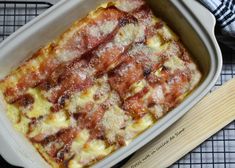 a casserole dish with meat and cheese in it