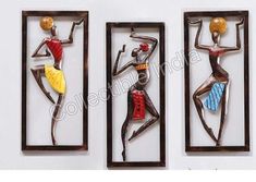 three metal wall hangings with woman's body in different colors and designs on them