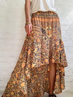 "This is very comfortable light and silky maxi skirt with high low deign  Delicate ruffles, true bohemian, gypsie style, with floral patterns  perfect holiday and party skirt  MEASURE size M elastic waist is 26\"-34\" length is 40\" More trendy boho ideas at  https://www.etsy.com/shop/AltheaStores? Thank You for looking" Bohemian Mini Skirt For Beach, Flowy Ruffled Summer Maxi Skirt, Bohemian Layered Maxi Skirt For Spring, Bohemian Tiered Flowy Skirt, Bohemian Layered Hem Maxi Skirt For Spring, Bohemian Wrap Skirt For Vacation, Bohemian Tiered Skirt With Layered Hem, Bohemian Flowy Maxi Skirt With Layered Hem, Flowy Boho Print Tiered Maxi Skirt