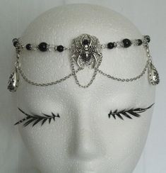 "Spider Circlet This beautiful beaded circlet has clear faceted glass beads, black glass beads, pewter silver accent drops, sterling silver plated chain, sterling silver plated spiderweb and pewter silver spider with rhinestone. 20\" long can be adjusted to 24\" long. Lobster clasp." Gothic Silver Jewelry For Costume Party, Silver Beaded Metal Body Jewelry, Silver Metal Jewelry For Costume Party, Witchy Silver Jewelry For Parties, Fantasy Adjustable Jewelry For Costume Party, Gothic Adjustable Body Jewelry For Halloween, Halloween Festival Jewelry With Black Beads, Black Fantasy Jewelry For Costume, Black Fantasy Jewelry For Costume Party