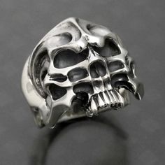 made by Strange Freak Designs SFD-R-014 creature skull ring. half skull made in JAPAN if you want other ring gauge please contact us. Gothic Silver Skull Ring, Symbolic Hand Cast Skull Ring, Gothic Skull Ring Collectible, Gothic Skull Collectible Rings, Gothic Skull Rings For Collectors, Silver Punk Skull Ring, Silver Skull Ring Collectible, Silver Symbolic Skull Ring For Halloween, Symbolic Silver Skull Ring For Halloween