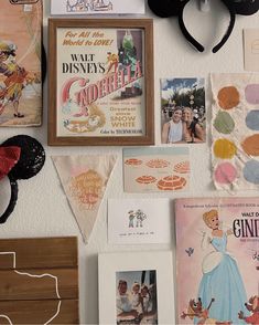 there are many disney related items on the wall