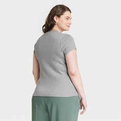 Update your everyday top closet with this Short-Sleeve Ribbed T-Shirt from A New Day™. This short-sleeve T-shirt in a solid color makes a go-to choice for easy pairing with a range of casual outfits. Styled in a regular fit, it features a basic crewneck and a ribbed finish for a timeless and textured look. The soft and breathable fabric with a hint of stretch ensures a comfortable and flexible fit. You can coordinate it with different bottoms and match with layering pieces to create a range of v Gray Ribbed Crew Neck T-shirt, Ribbed Short Sleeve Tops For Workwear, Gray Short Sleeve Top For Work, Gray Short Sleeve Top, Basic Crewneck, Layering Pieces, A New Day, Heather Gray, New Day