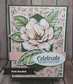 a card with a flower on it and the words celebrate written in white lettering,