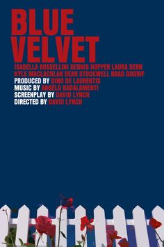 blue velvet poster with red flowers in front of a white picket fence