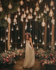 a woman standing in front of a bunch of lights