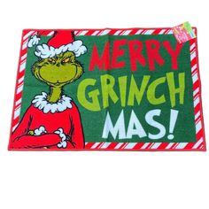 the grinch christmas door mat is on display