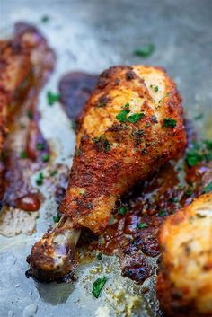 two pieces of cooked meat sitting on top of a pan