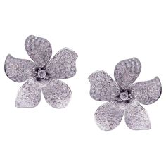 This large diamond classic pave five petals flower earring is crafted in 18-karat white gold, featuring 303 round white diamonds totaling of 6.53 carats. Approximate total weight 14.41 grams. These earrings come with push back post backings. SI-G Quality natural white diamonds. Luxury Diamond Cut Flower-shaped Earrings, Flower Earring, Flower Tops, Jewelry Diamond, Gems Jewelry, White Diamonds, Flower Earrings, White Gold Diamonds, Jewelry Earrings Studs